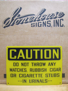 DO NOT THROW ANY MATCHES, RUBBISH CIGAR OR CIGARETTE STUBS IN URINALS NOS SIGN STONEHOUSE SAFETY AD