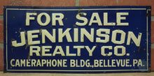 Load image into Gallery viewer, JENKINSON REALTY Co CAMERAPHONE Bldg BELLEVUE PA Old Embossed Tin Ad Sign
