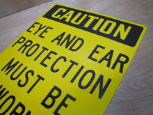 Load image into Gallery viewer, CAUTION EYE AND EAR PROTECTION MUST BE WORN Old Sign Industrial Repair Shop Ad
