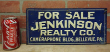 Load image into Gallery viewer, JENKINSON REALTY Co CAMERAPHONE Bldg BELLEVUE PA Old Embossed Tin Ad Sign
