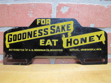 Load image into Gallery viewer, FOR GOODNESS SAKE EAT HONEY Old License Plate Topper Ad Sign WOODMAN Co BEEKEEPERS SUPPLIES GRAND RAPIDS MICH
