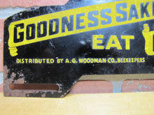 Load image into Gallery viewer, FOR GOODNESS SAKE EAT HONEY Old License Plate Topper Ad Sign WOODMAN Co BEEKEEPERS SUPPLIES GRAND RAPIDS MICH
